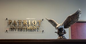Patriot Investment plaque with statue of eagle