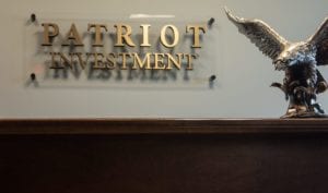 Patriot Investment plaque with statue of eagle
