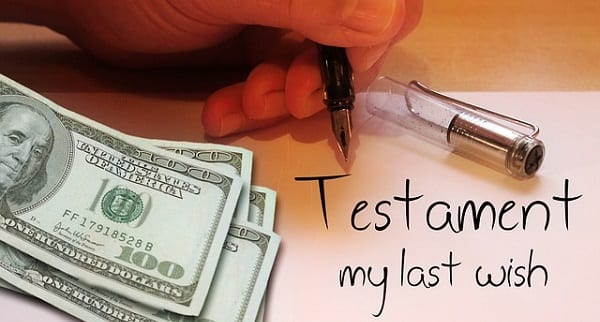 Hundred dollar bills next to writing that says "testament - my last wish"